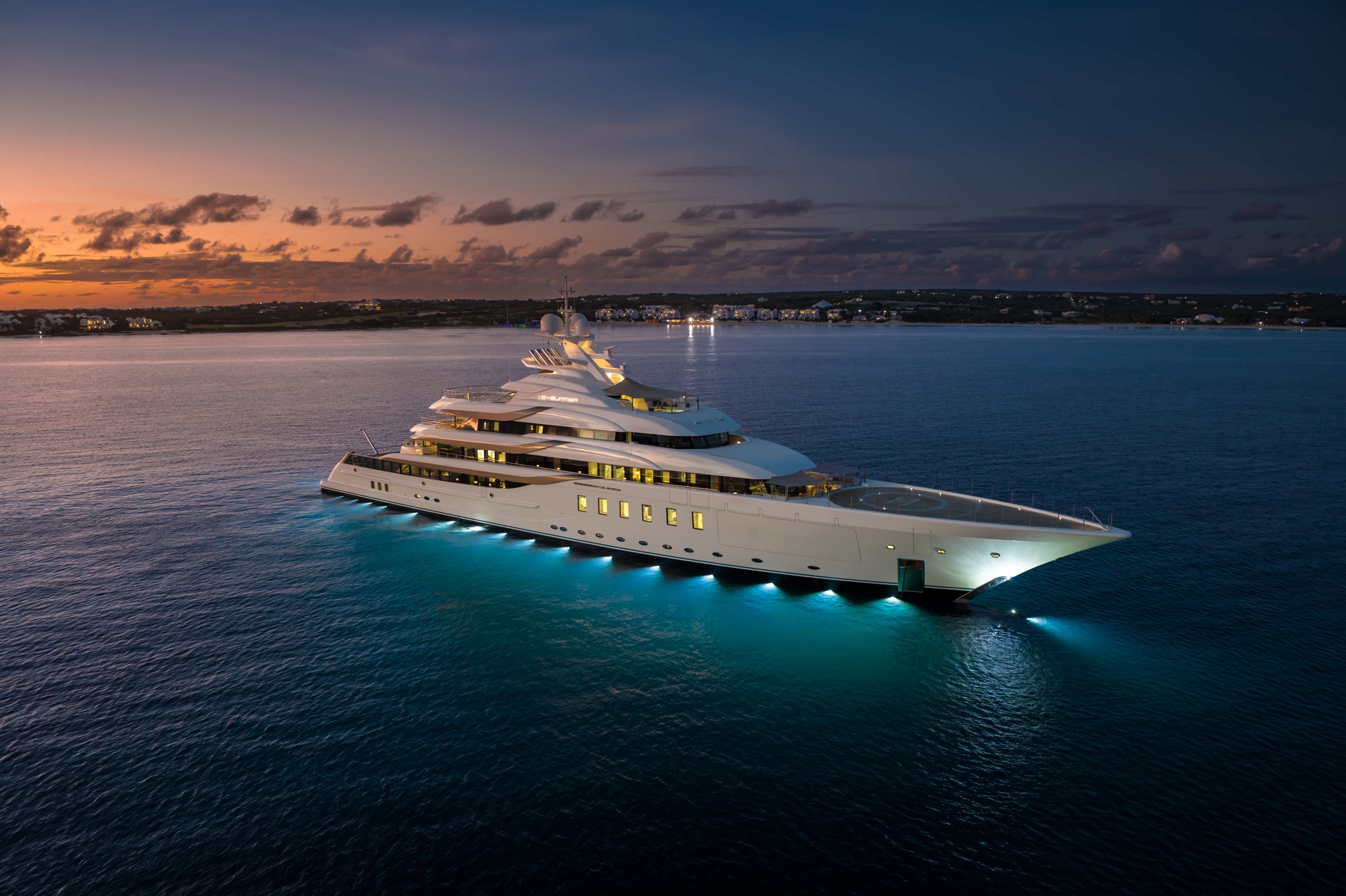 Yacht Out on the Water At Night With Lights