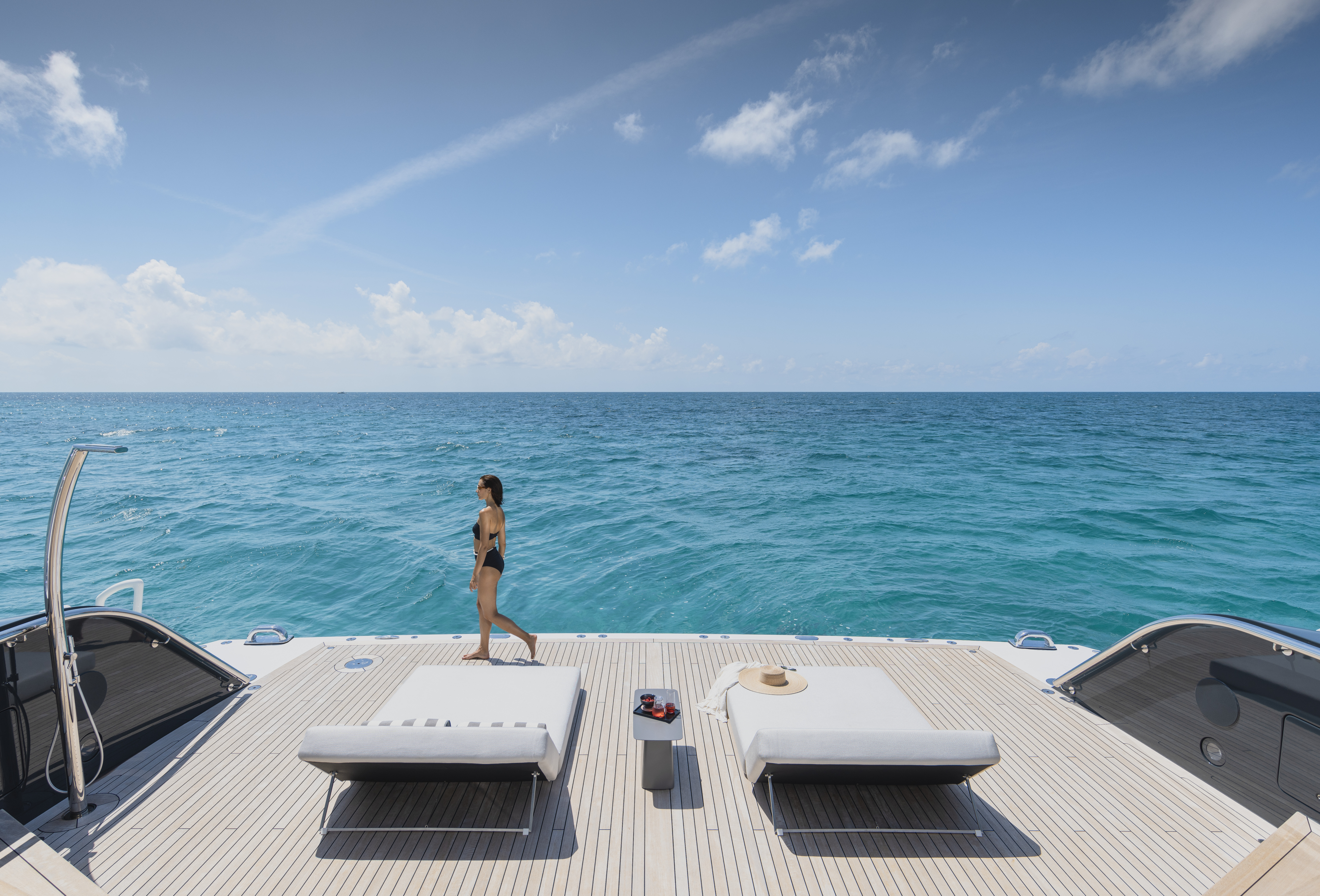 Woman Aboard a Yacht with Blue Ocean in Background